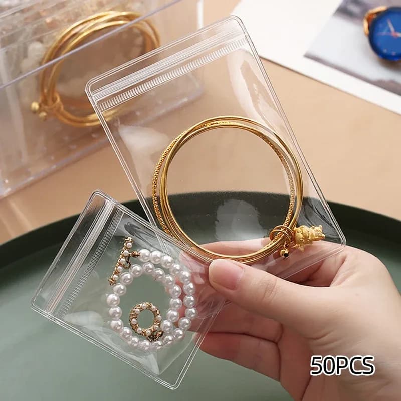 Lot de 50 pochettes à bijoux transparentes anti-ternissement