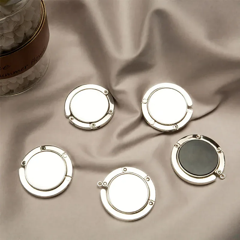 Accroche-sac pliable en cristal pour table